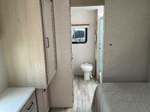 The bathroom view from the master bedroom inside of a Forest River camper.