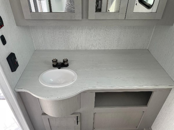 The sink in the bathroom of a Mallard Heartland camper.