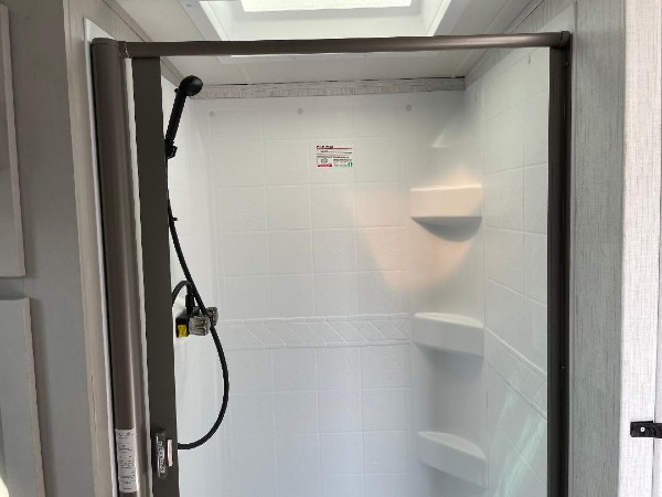 The shower inside of a Heartland Mallard RV.