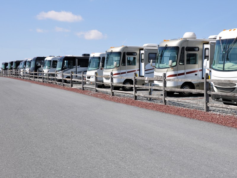 A line of RVs waiting to be sold