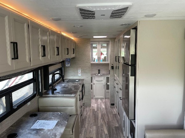The kitchen inside of a Thor Motor Coach Axis.
