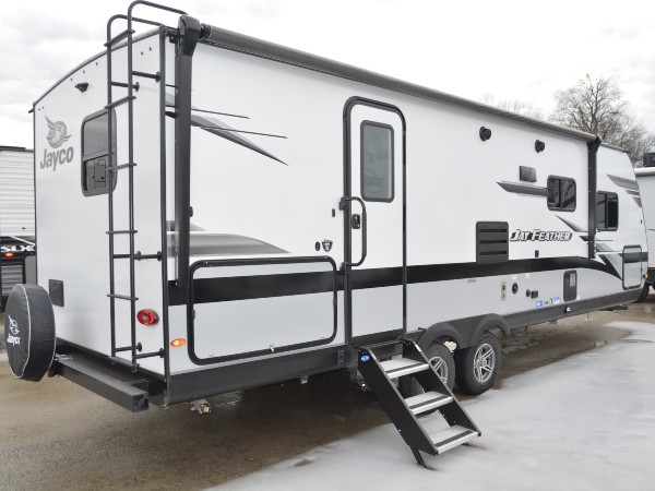 A new white fifth wheel ready to be sold