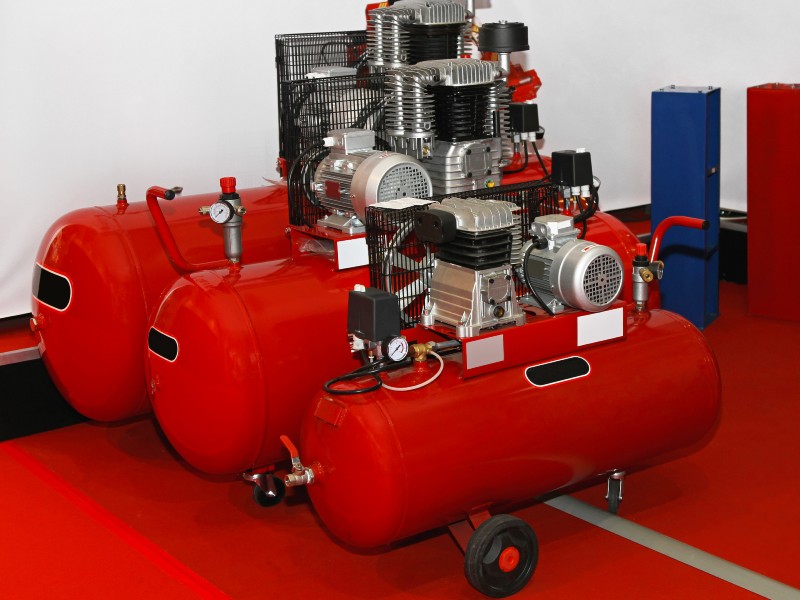 Red air compressors waiting to get used