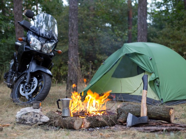 Camping in the woods with a motorbike