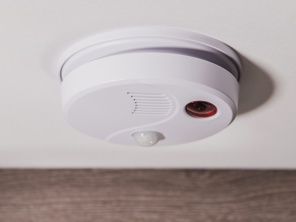 A carbon monoxide detector on the ceiling of a RV