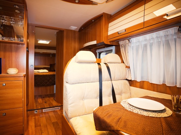 dining space in motorhome with a white seat