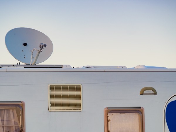 A satellite dish on a rv rooftop