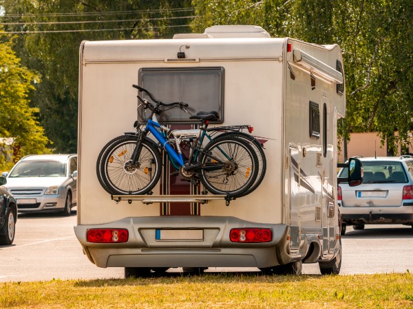 two bikes on the back of a camper