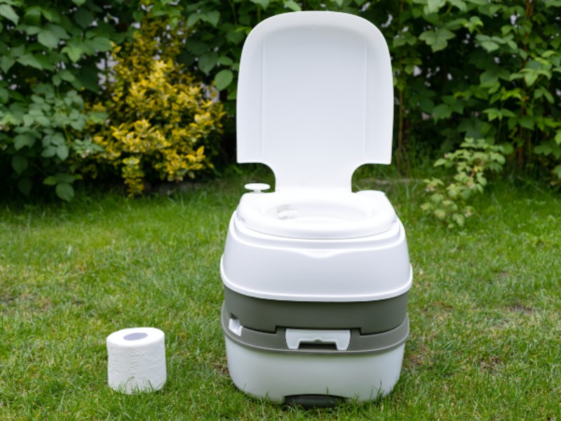 A portable white toilet
